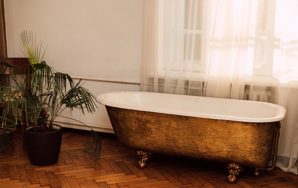 Vintage bathroom interior with cast iron bathtub