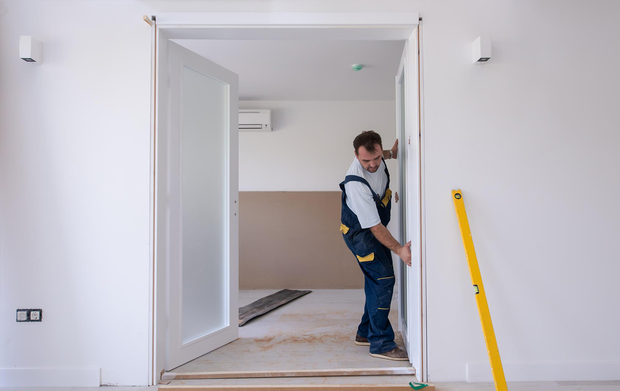 Man installing internal doors