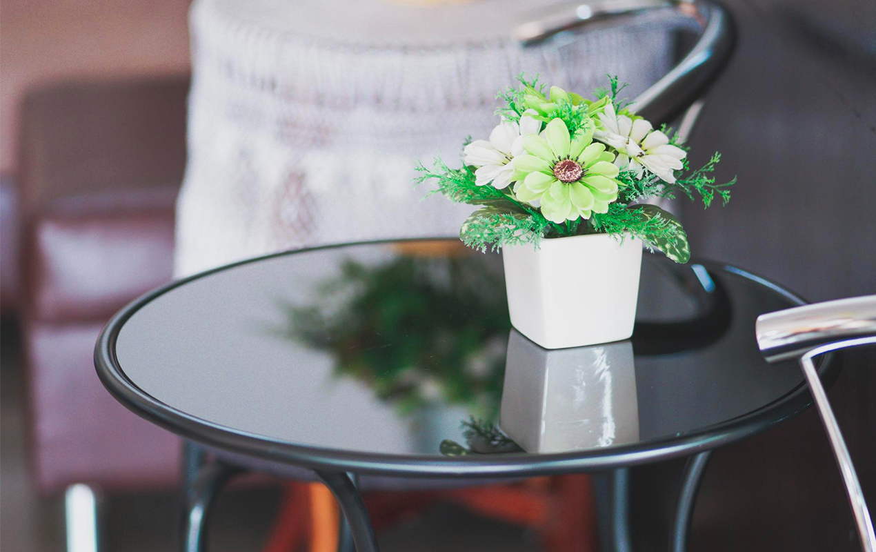 Round table with planter and florals