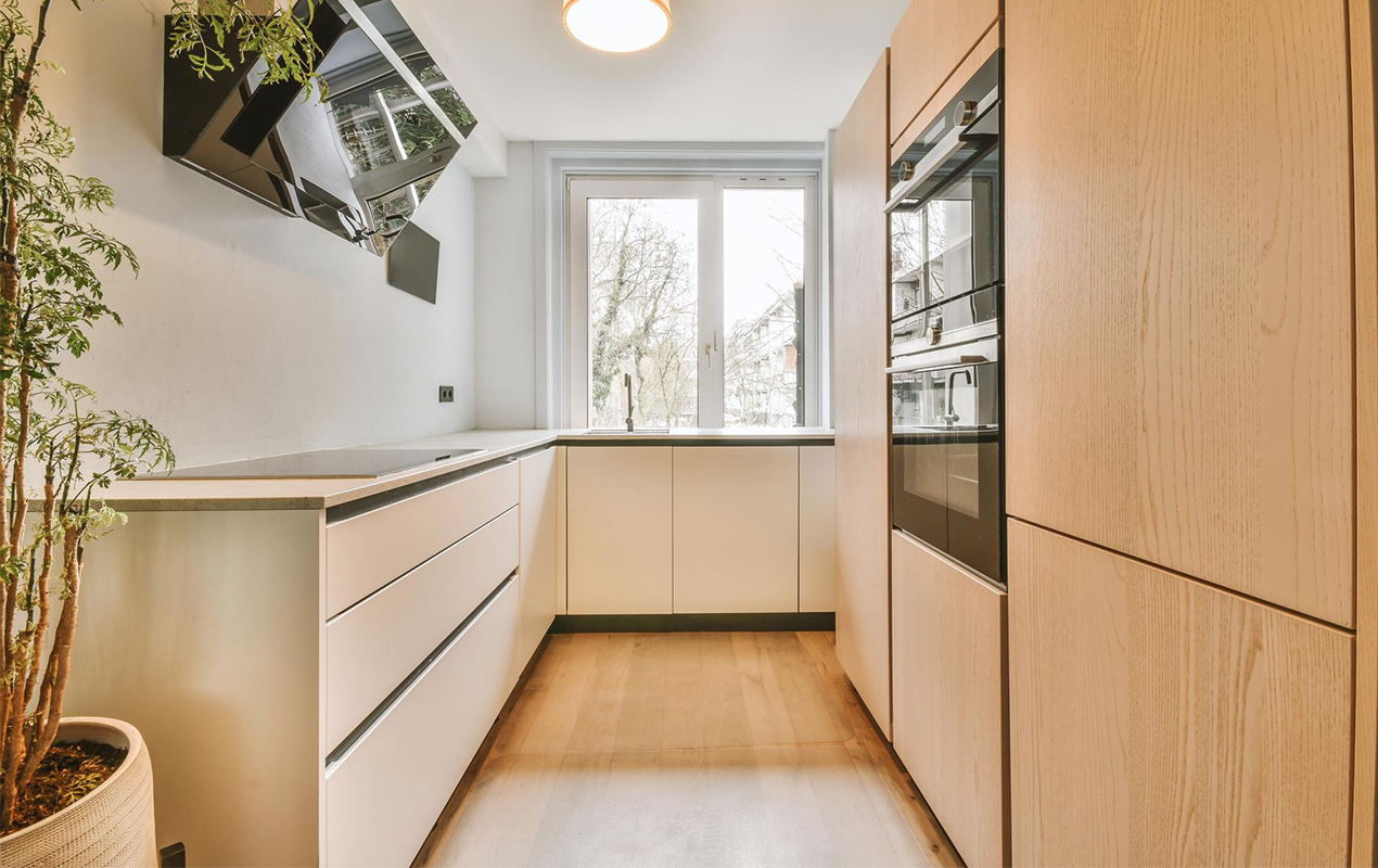 Scandi kitchen design with high cabinets