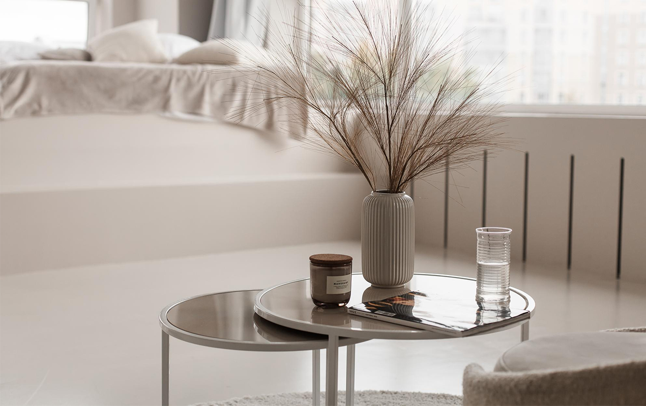 Neutral living room interior with round feng shui glass coffee tables