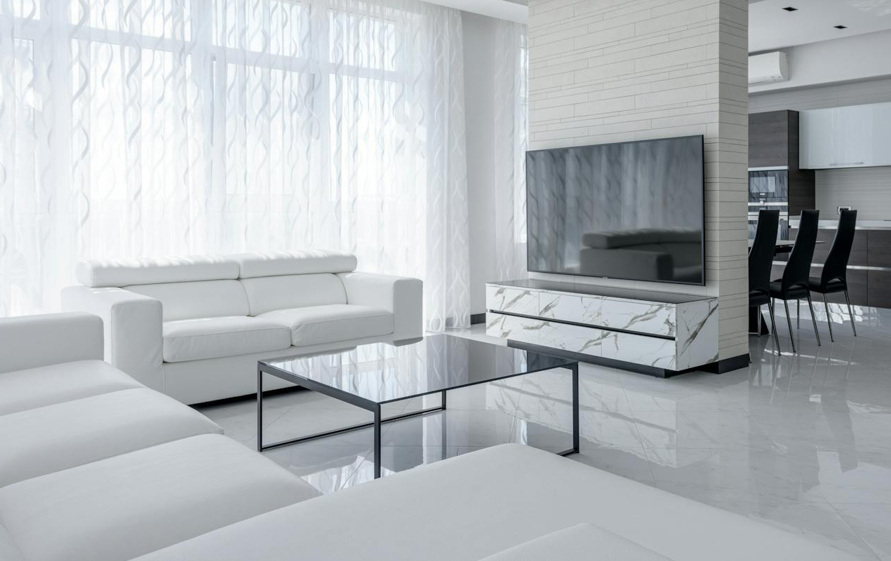 White living room interior with glass coffee table sliding