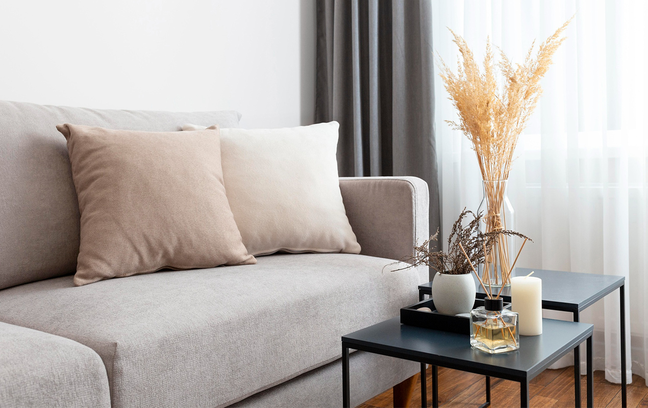 Living room interior with gray sofa and decor