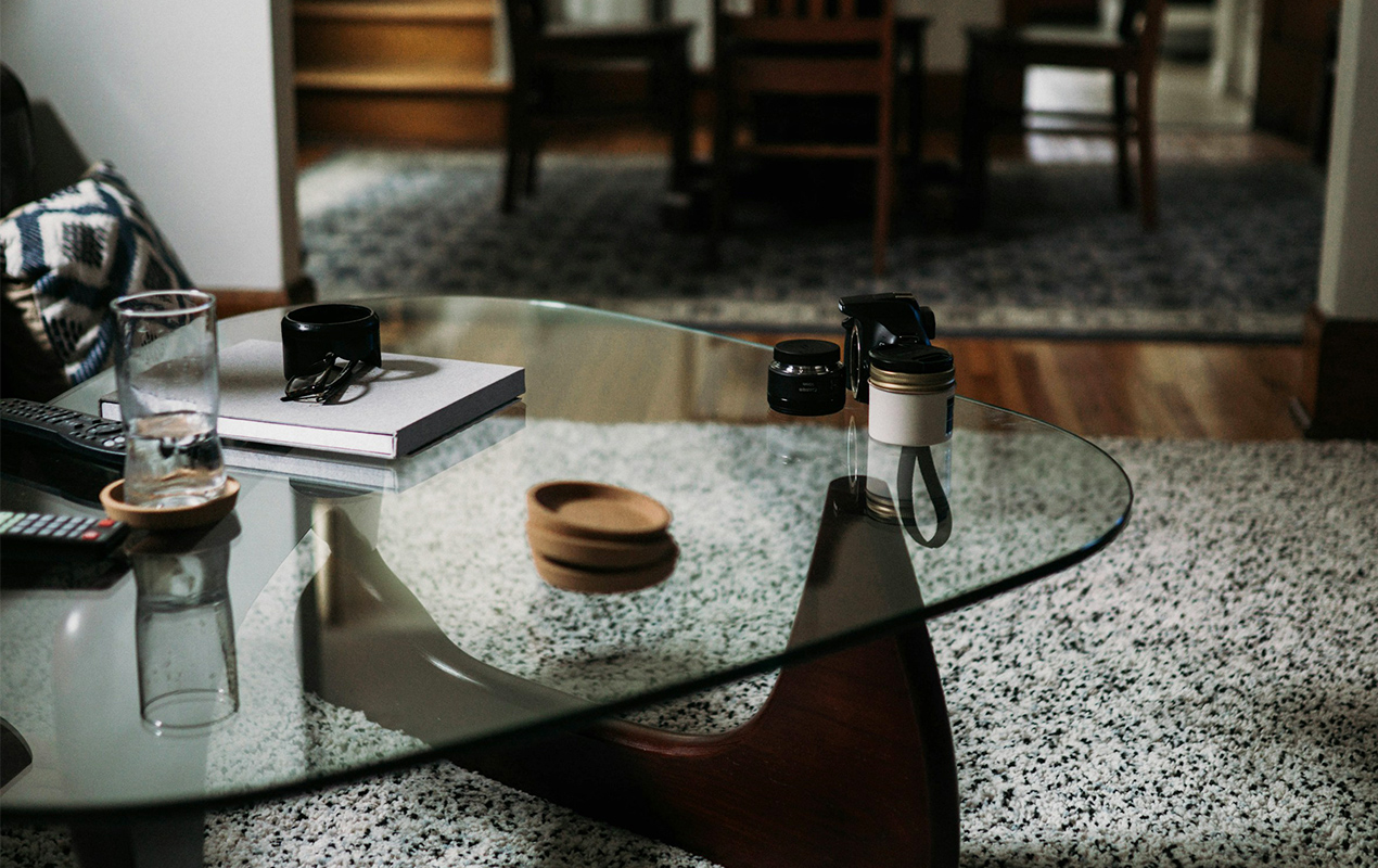 Living room interior with glass table and coasters