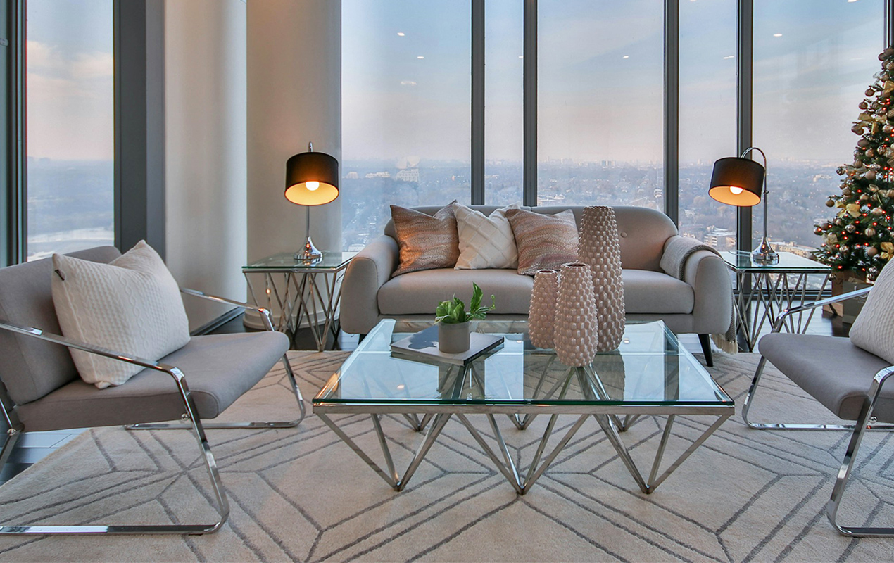 Modern living room interior with glass coffee table and serving tray