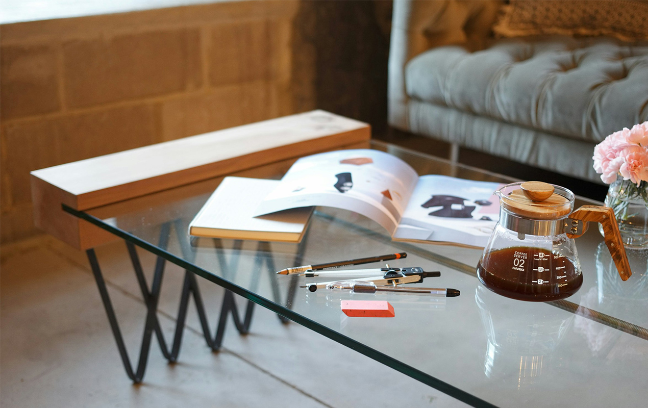 Modern furniture with books, pens, and pencils.