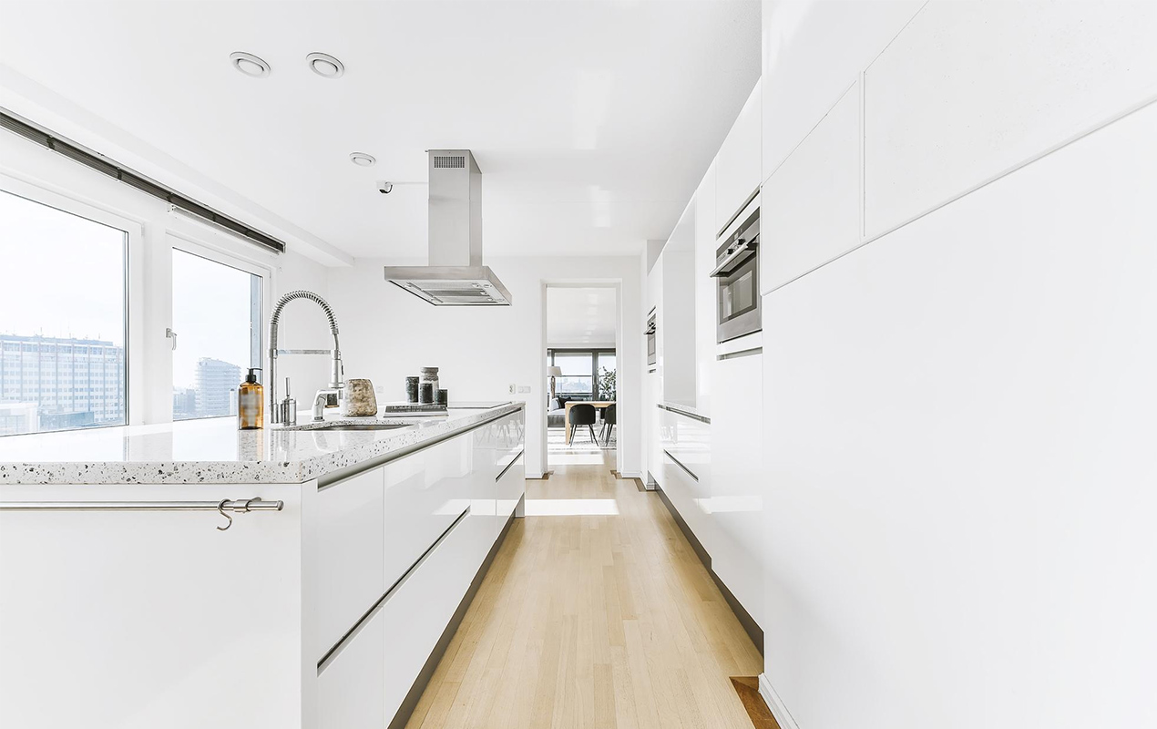 White kitchen interior with chrome taps