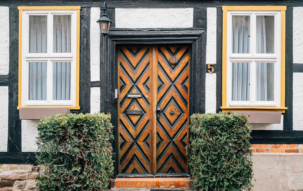 Cottage home with wooden double doors